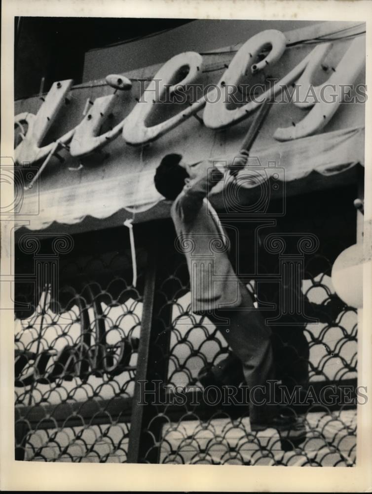 1956 Press Photo Protester damages sign during demonstration by Greek students - Historic Images