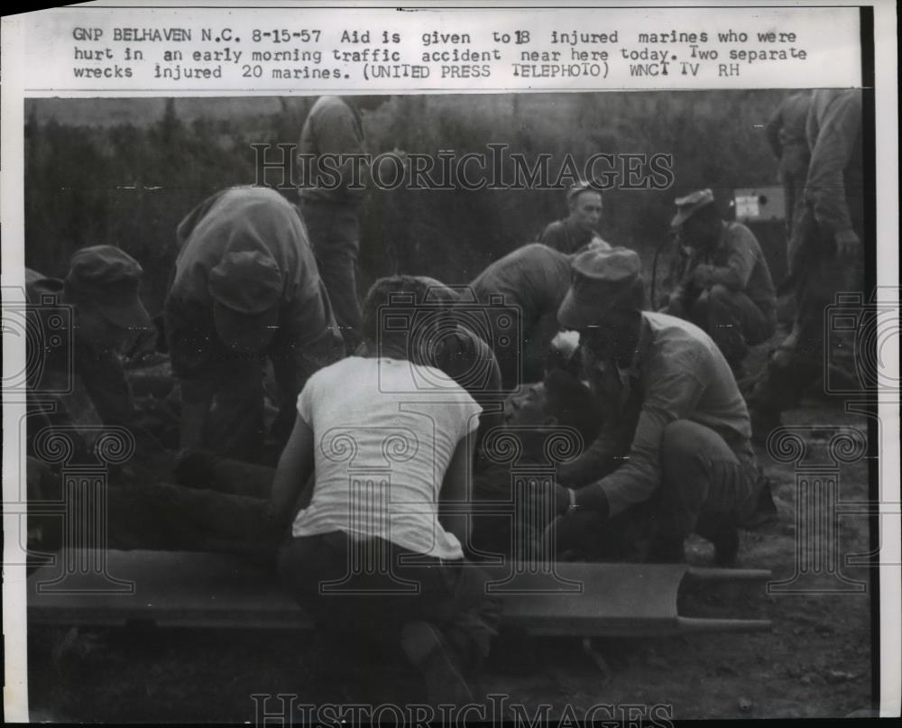 1957 Press Photo Aid given to 18 injured marines in traffic accident - Historic Images