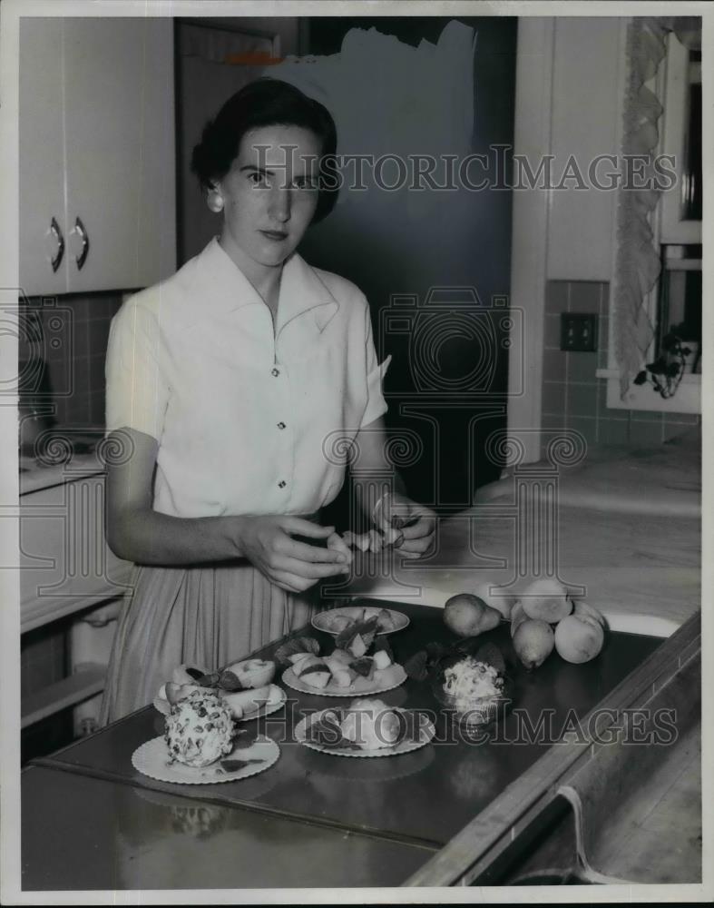 1955 Press Photo Rita Cummis demonstrates fresh fruit tricks - nef03444 - Historic Images