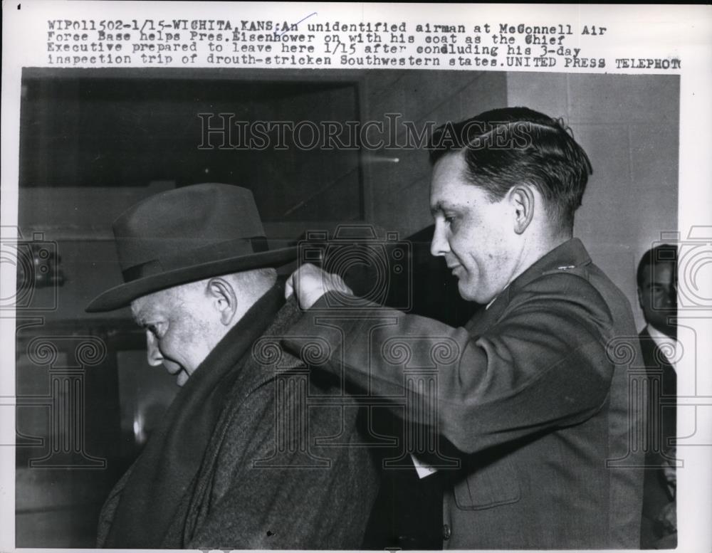 1957 Press Photo Man Helps President Dwight D. Eisenhower Put on Coat - Historic Images