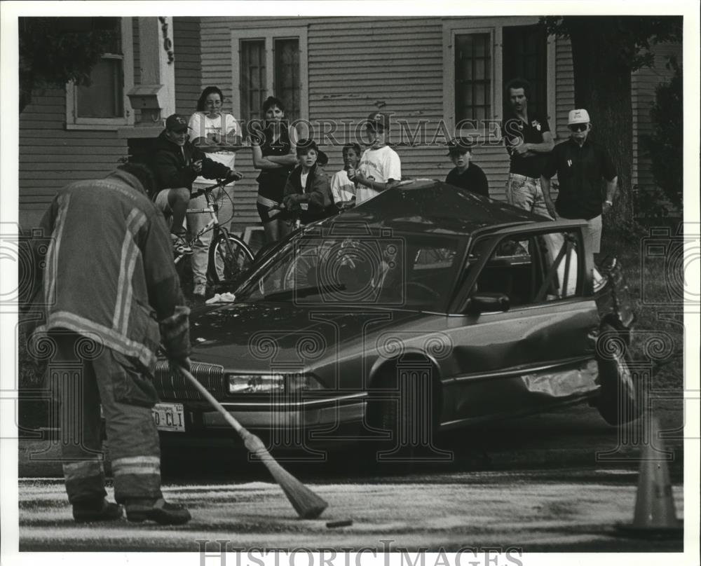 1993 Press Photo Spokane Firefighters Clean Up Antifreeze After Car Crash - Historic Images