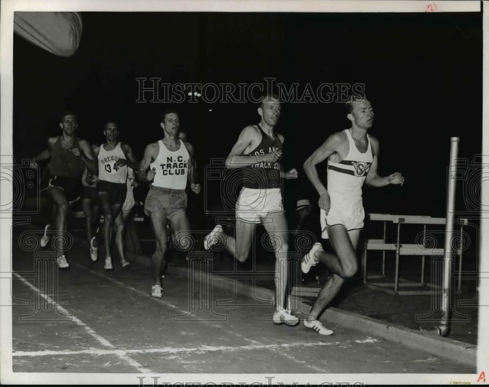 Press Photo College men at a track meet race - net17058 - Historic Images