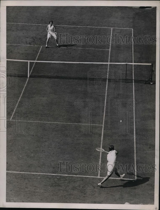 1934 Press Photo Two men in action in a tennis match on the courts - net17930 - Historic Images
