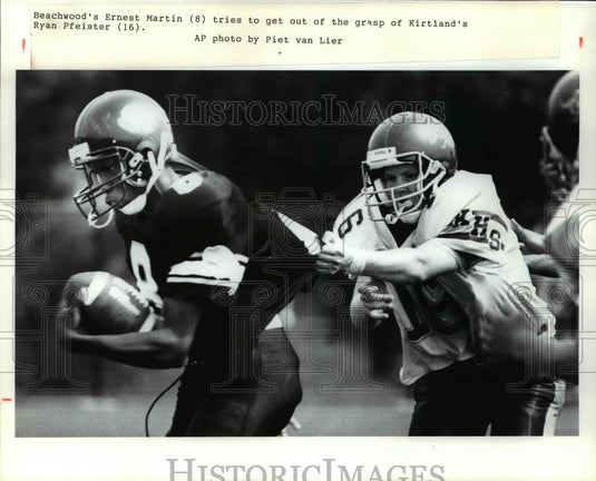 Press Photo Beachwood's Ernest Martin (8) tries to get out of grasp. - Historic Images