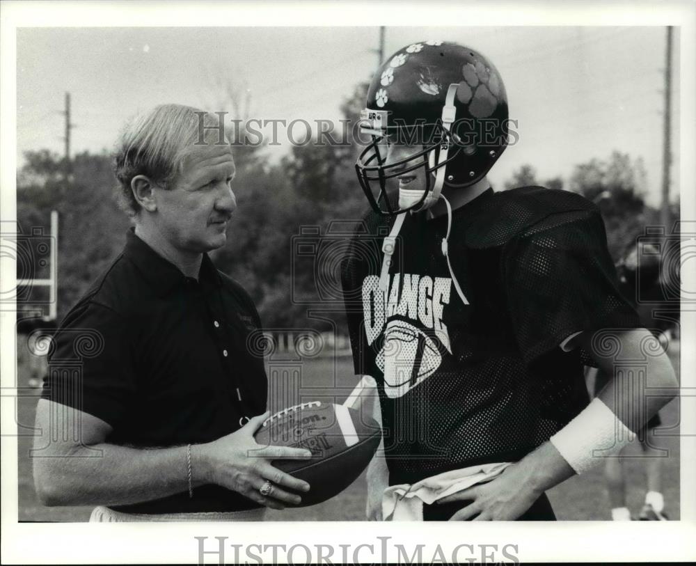 1991 Press Photo Chuck and Lance Reisland, Orange Football. - cvb63975 - Historic Images