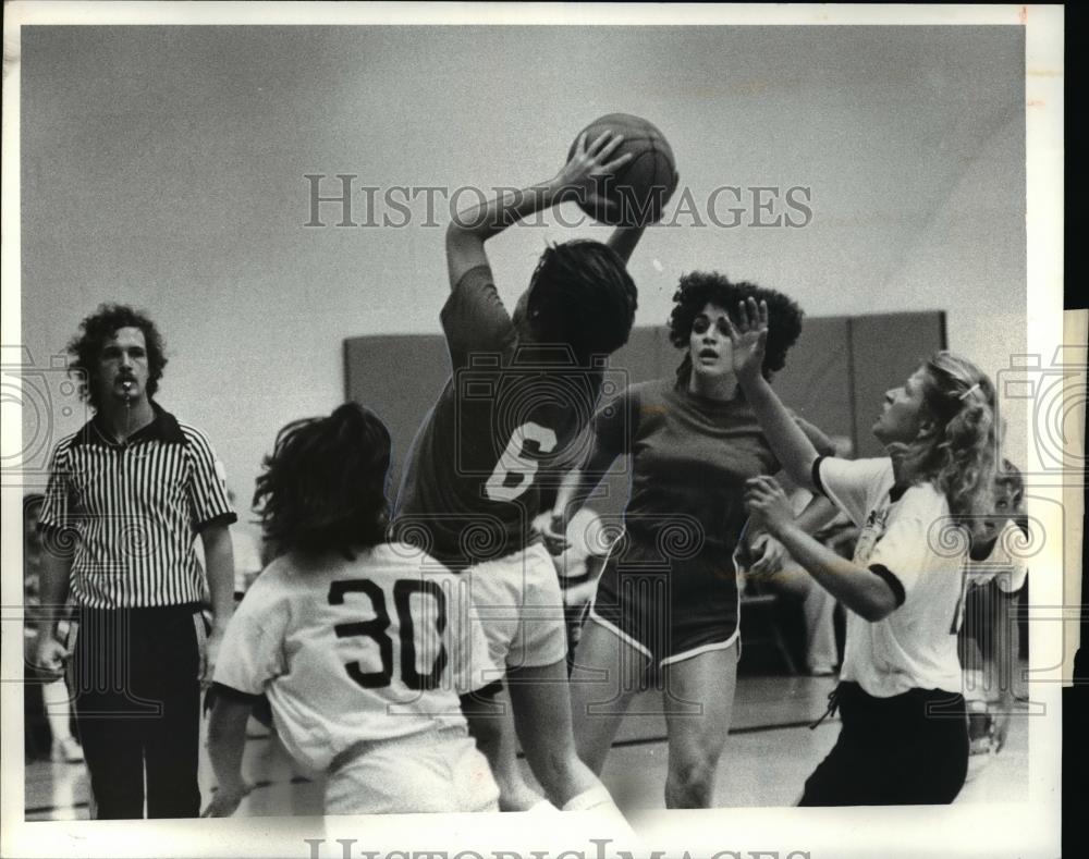 Press Photo Tire and Wheel against Old Front Bar basketball game - cvb69143 - Historic Images