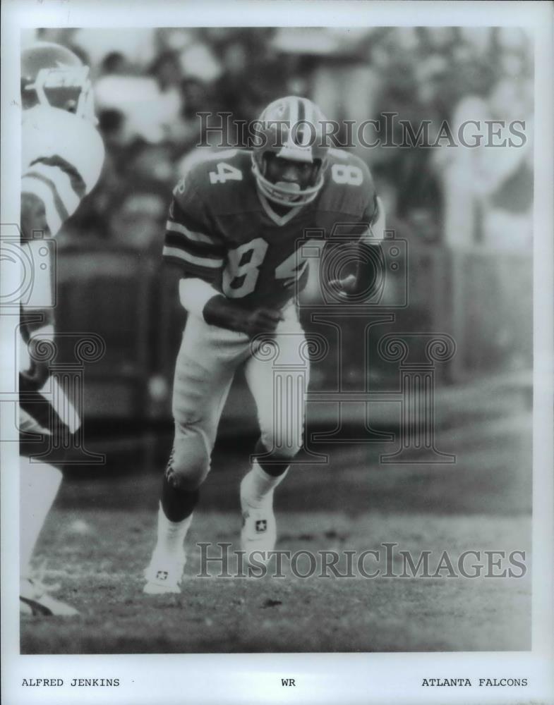 Press Photo Atlanta Falcons player Alfred Jenkins in a football action scene - Historic Images