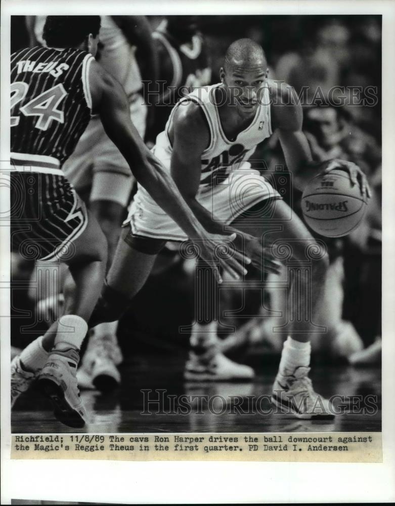 1989 Press Photo The Cavs' Ron Harper drives ball against Magic's Reggie Theus - Historic Images