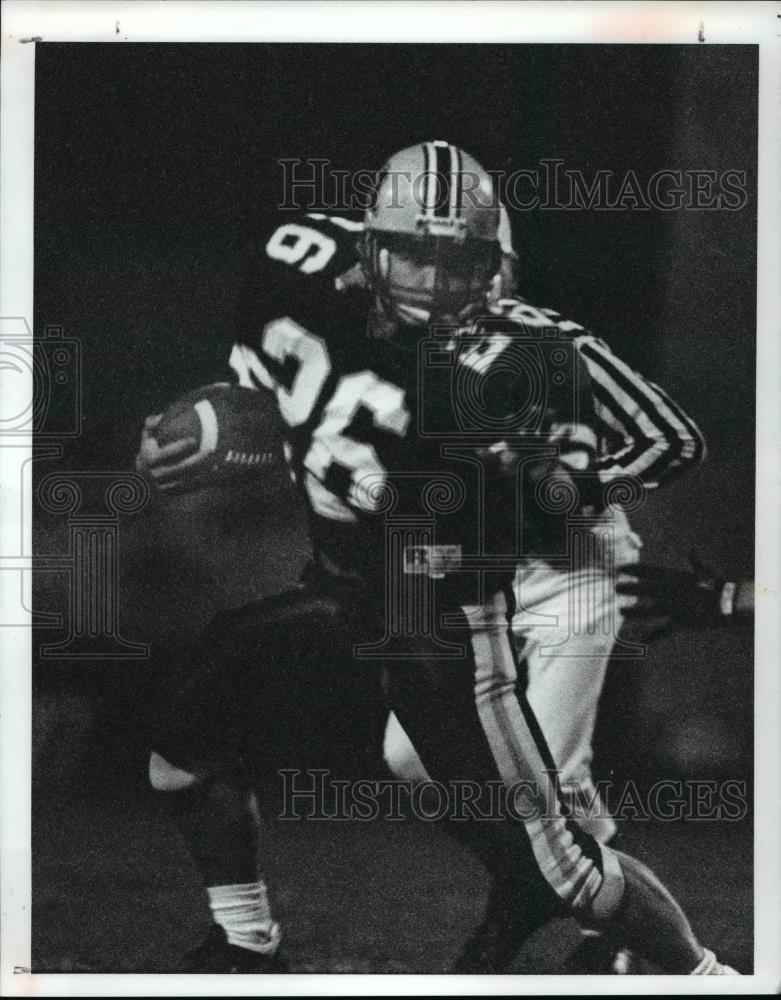 1991 Press Photo Midview Runningback Chris Riddick (26) gets the ball - Historic Images