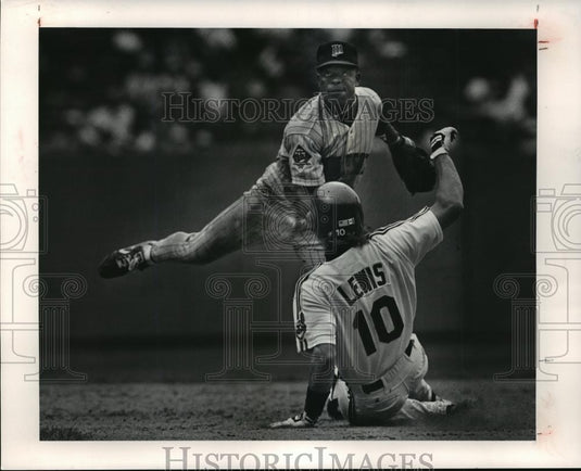 Press PhotoAl Newman throws to first while Indians, Mark Lewes slides into base - Historic Images