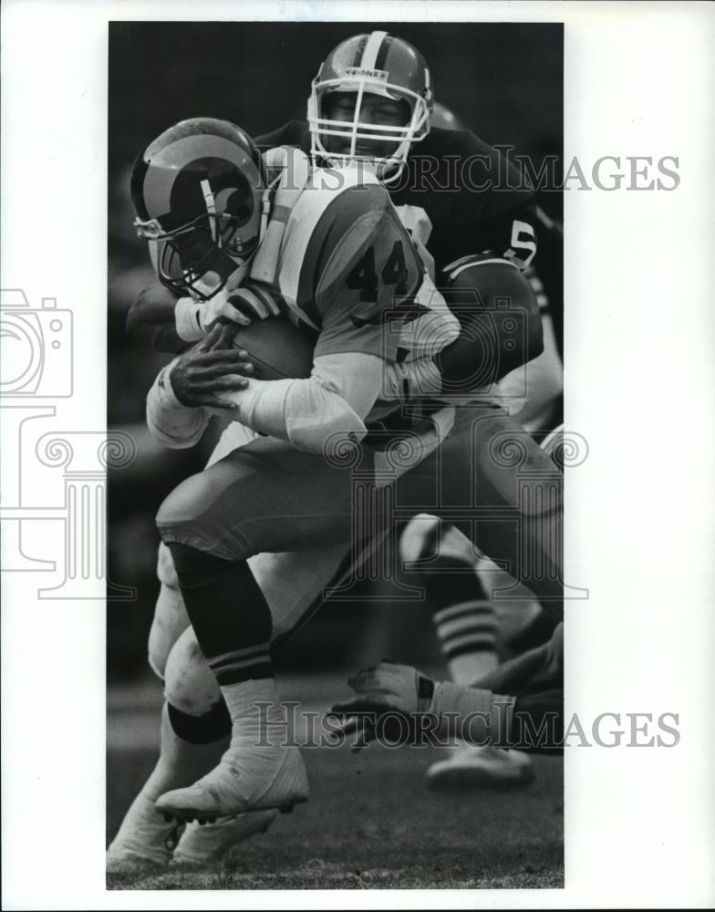 1990 Press Photo Gaston Green runs for 4 yards as Mike Johnson tackles him. - Historic Images