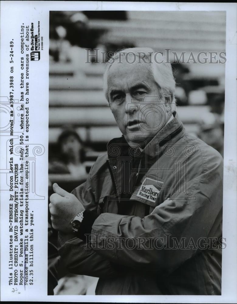 1989 Press Photo Roger S. Penske watching Indy 500 racing trials. - cvp98866 - Historic Images