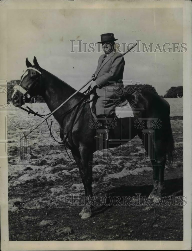 Press Photo Man on Horse Holding Stick - nef02048 - Historic Images