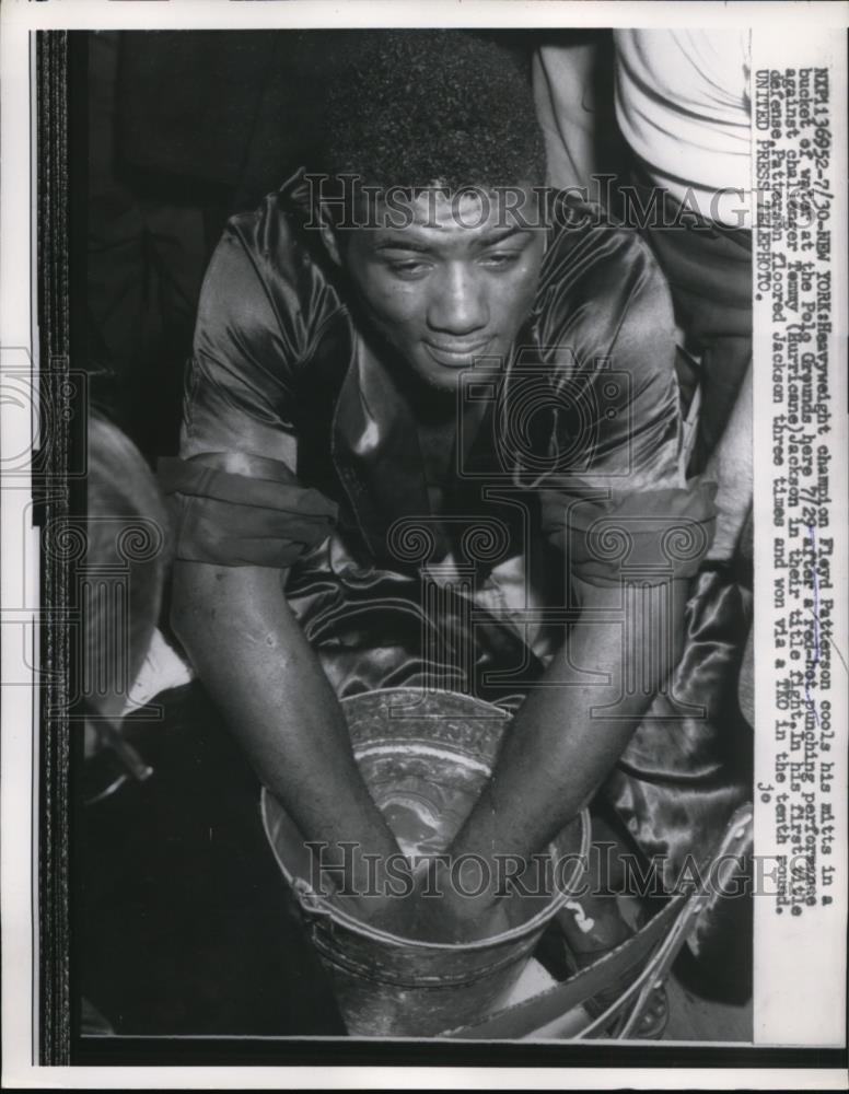 1957 Press Photo Floyd Patterson ices down hands after Hurricane Jackson fight - Historic Images