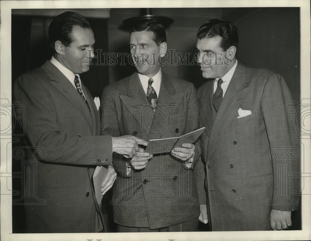 1944 Press Photo Sam Cordovana and Attorneys Talk Over NFL Rule Book - cvb76415 - Historic Images
