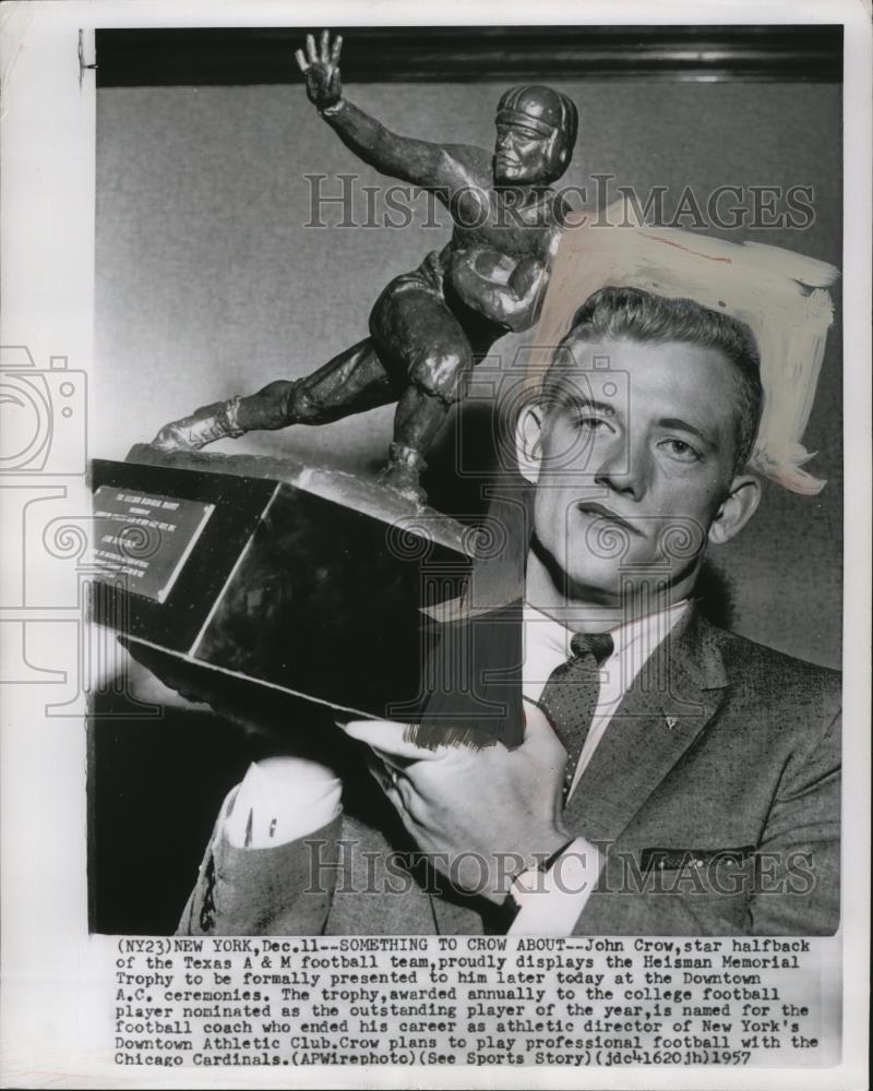 1957 Press Photo John Crow displays the Heisman Memorial Trophy awarded to him - Historic Images
