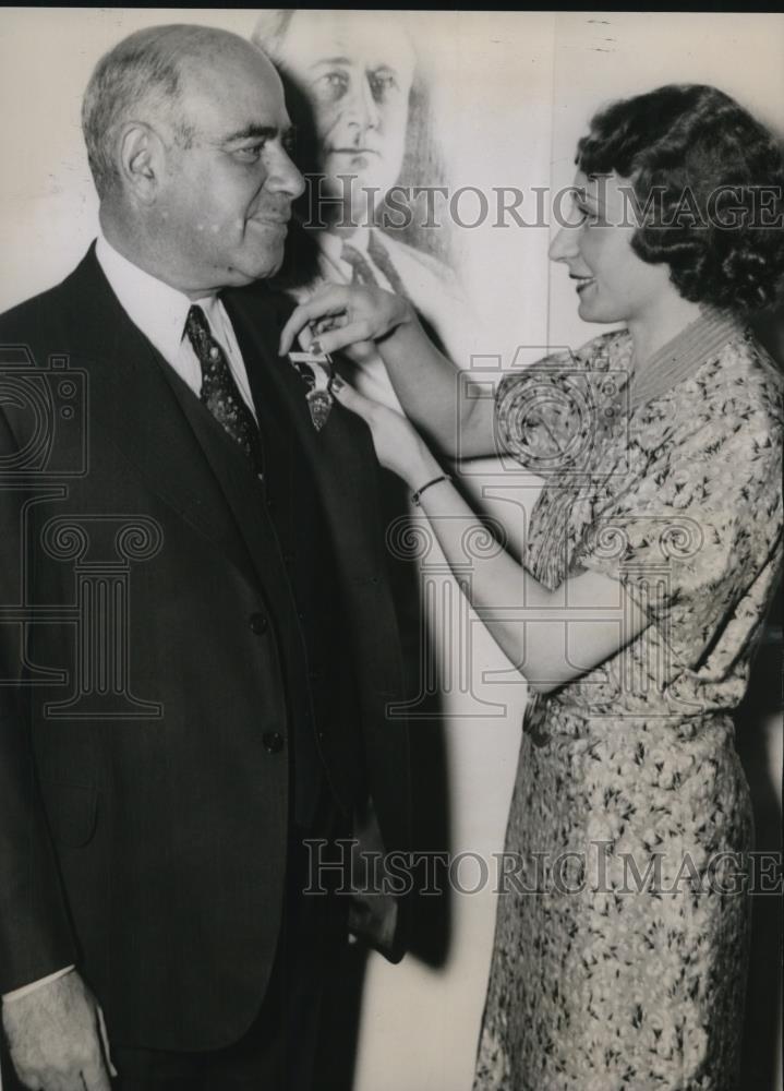 1936 Press Photo Woman Pinning Medal on Man - nef25362 - Historic Images