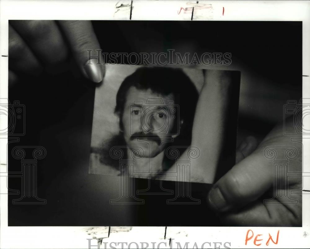 1991 Press Photo Ruth Hlvasa holds a photo of her brother Frank Plaga - Historic Images