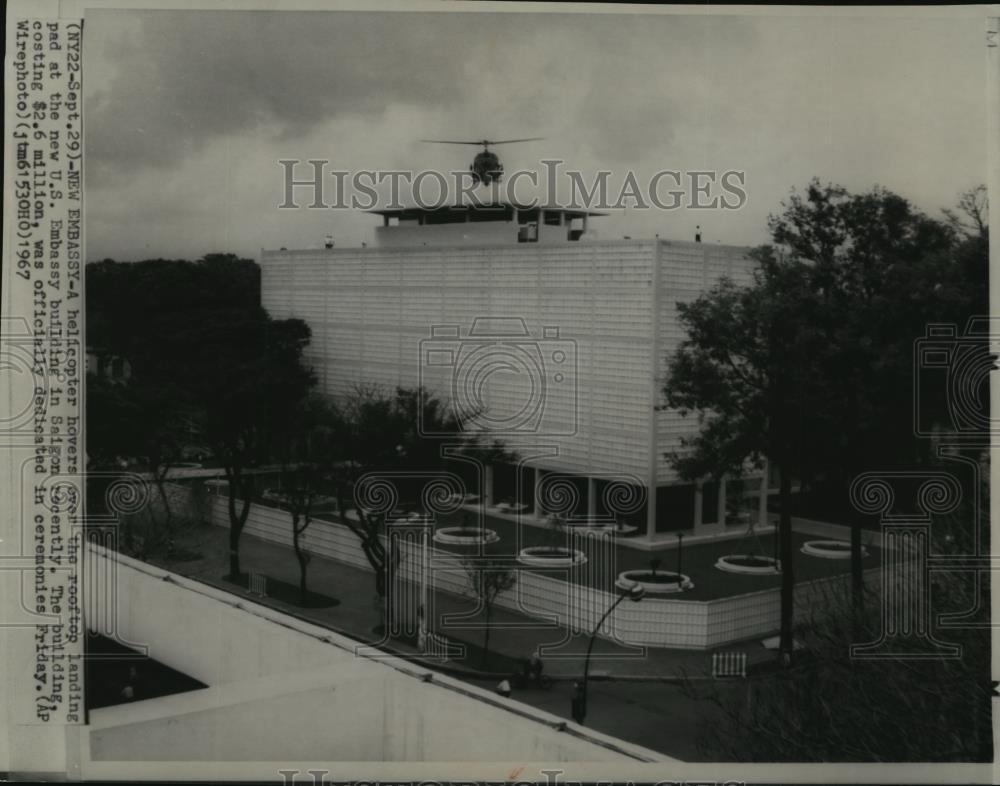 1967 Wire Photo A helicopter hovers over the rooftop of US Embassy in Saigon - Historic Images