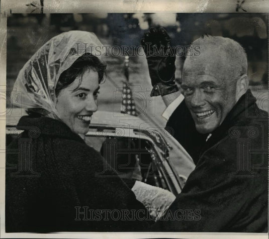 1962 Wire Photo Mr. & Mrs. John H. Glenn Jr. Smile Despite Rain at Parade - Historic Images