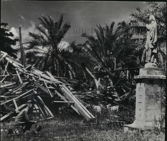 1943 Wire Photo US marine kneeling before unharmed statue of the Blessed Virgin - Historic Images