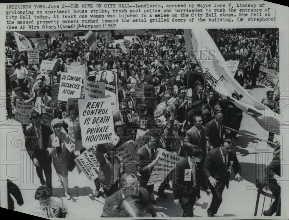 1967 Wire Photo Landlords brush past police to rush to City Hall in New York - Historic Images