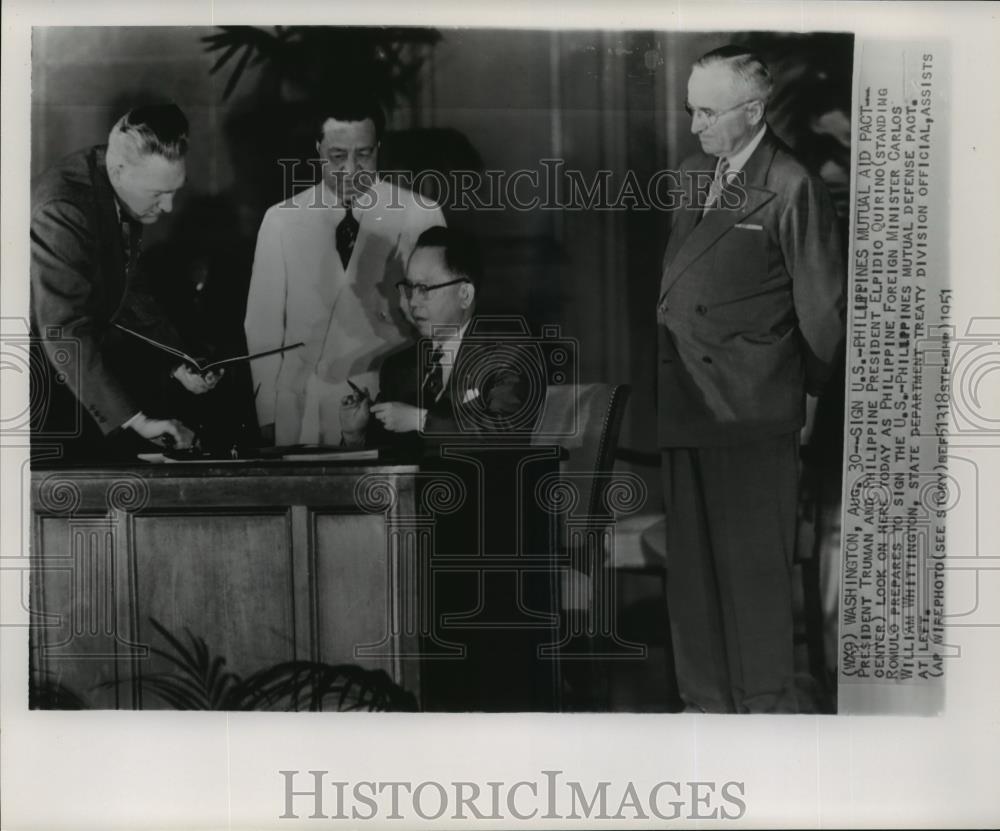 1951 Wire Photo U.S., Philippine leaders look on as Romulo signs Defense Pact - Historic Images