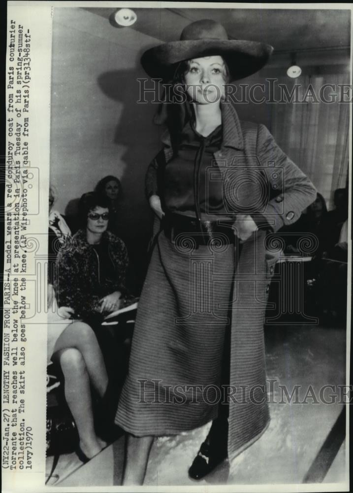 1970 Wire Photo Model wearing a red corduroy coat from couturier Torrente - Historic Images