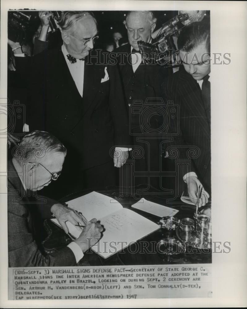 1941 Wire Photo Secretary of State George Marshall signing American defense - Historic Images