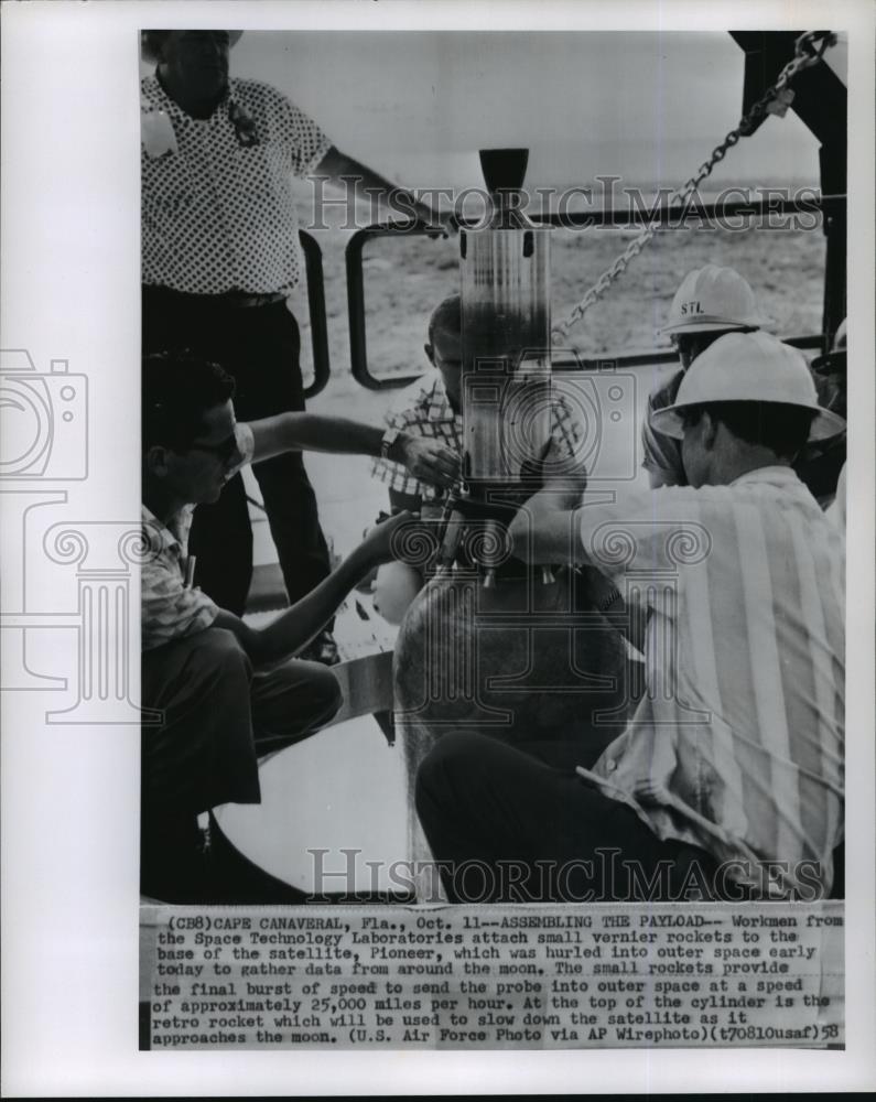 1958 Wire Photo Workmen attaching vernier rockets to Pioneer before it lanches - Historic Images