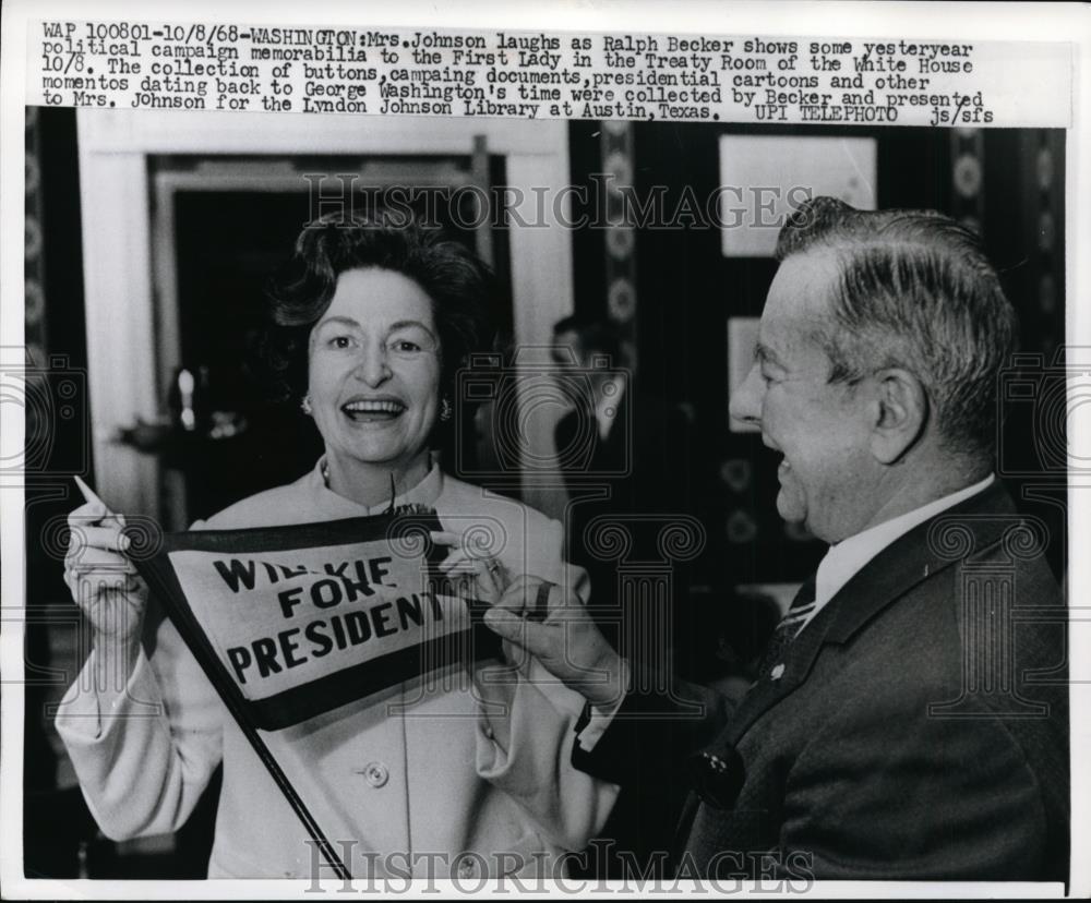 1968 Press Photo Mrs. Lyndon Johnson laugh as Ralph Becker show memorabilia - Historic Images