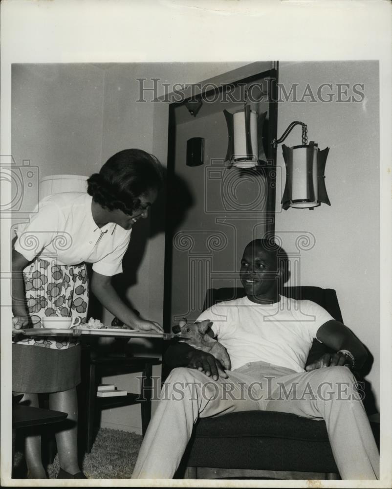 Press Photo A man sits in chair at his home with his wife - net28011 - Historic Images