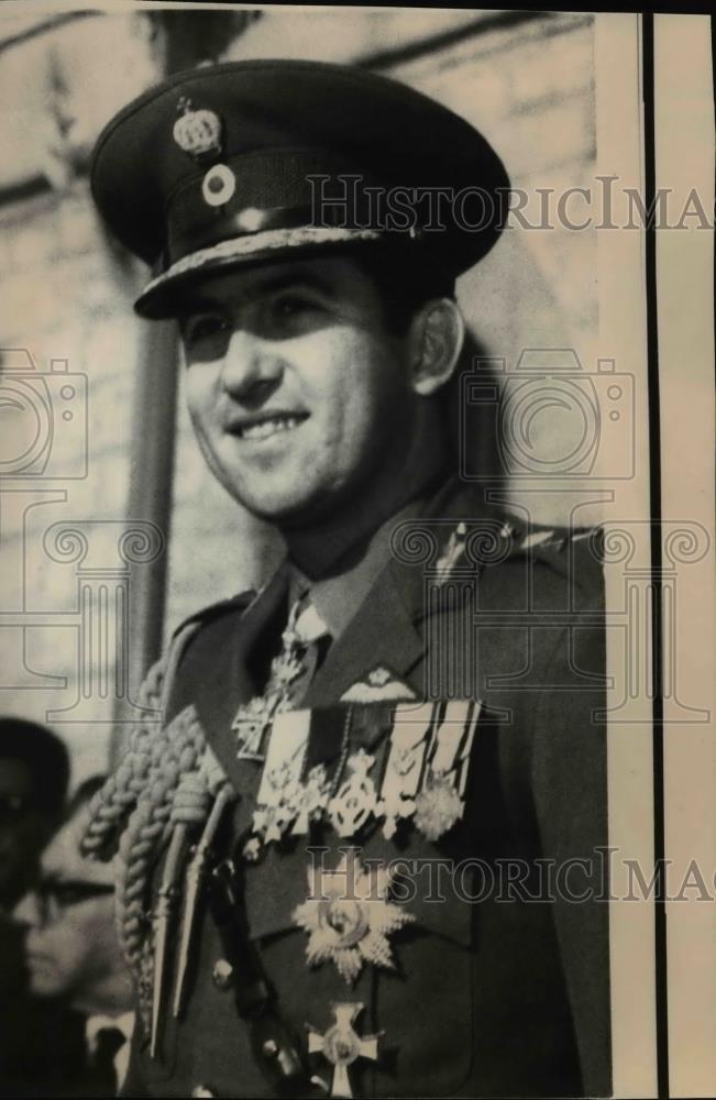 Wire Photo King Constantine of Greece smiles as he poses for the photographer - Historic Images