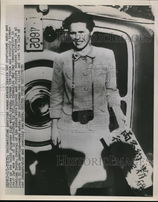 1959 Press Photo American Woman & Her Overturned Car in Tokyo Japan  - nef36329 - Historic Images