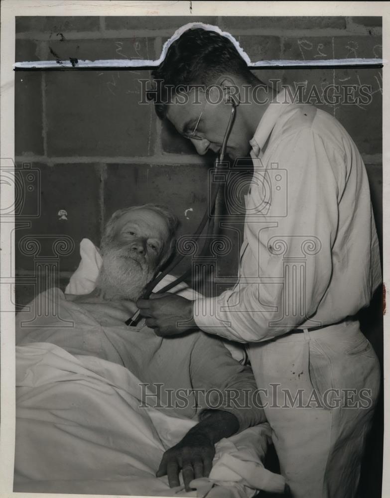 1934 Press Photo Pat Conway Check by Nurse D.A. Miller - nef36592 - Historic Images