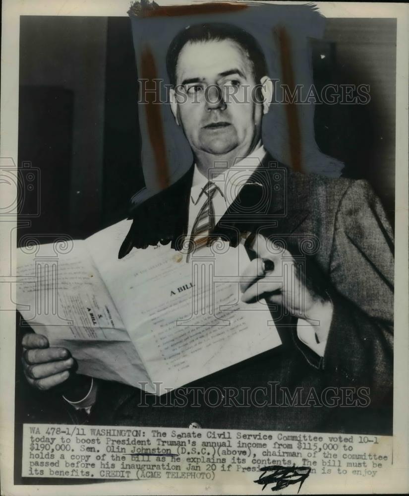 1949 Press Photo Sen.Olin Johnson holds a bill of the President Annual Income - Historic Images