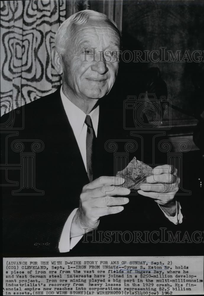 1962 Wire Photo Cyrus S Eaton Sr holds a piece of iron ore from Ungava Bay - Historic Images