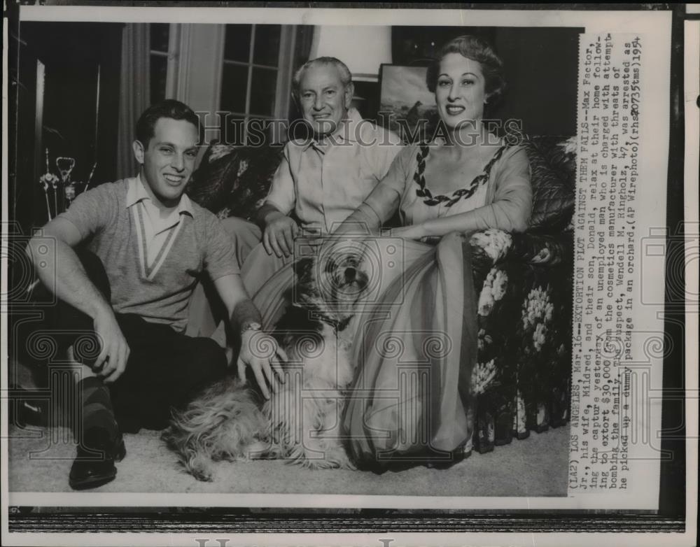 1954 Wire Photo Max Factor Jr. and family relax at their home after bomb threat - Historic Images