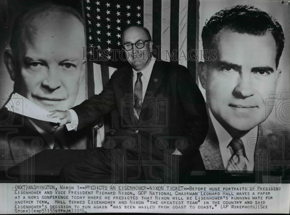 1956 Wire Photo L. Hall posing with portraits of Pres. Eisenhower and VP Nixon - Historic Images