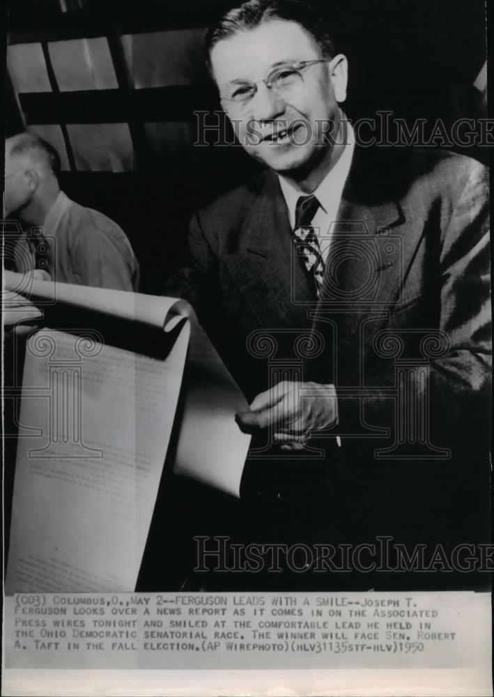 1950 Wire Photo Joseph T. Ferguson looking at a report of the Senatorial Race - Historic Images