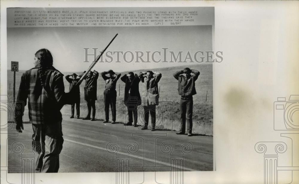 1973 Press Photo Government Officials &amp; Farmers Stand with Hands Behind Head - Historic Images