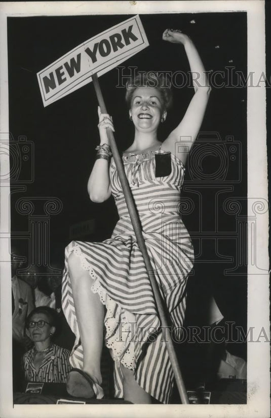 1948 Press Photo Virginia Bell Jack raises her state's banner - nef60434 - Historic Images