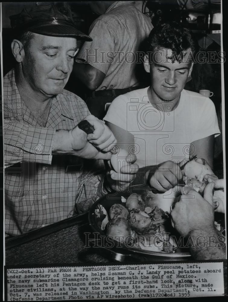 1955 Press Photo Charles C. Finucane helping C.J. Landy peel potatoes - Historic Images