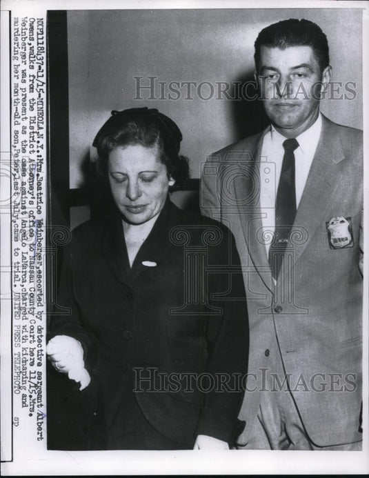 1956 Press Photo Mrs Beatrice Weinberger is escorted by detective Albert Owens - Historic Images