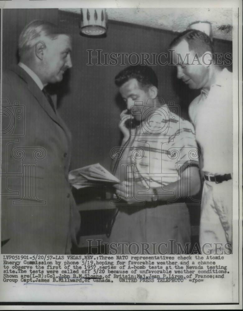 1957 Press Photo Three NATO Reps Check Atomic Energy Commission by Phone May 19 - Historic Images