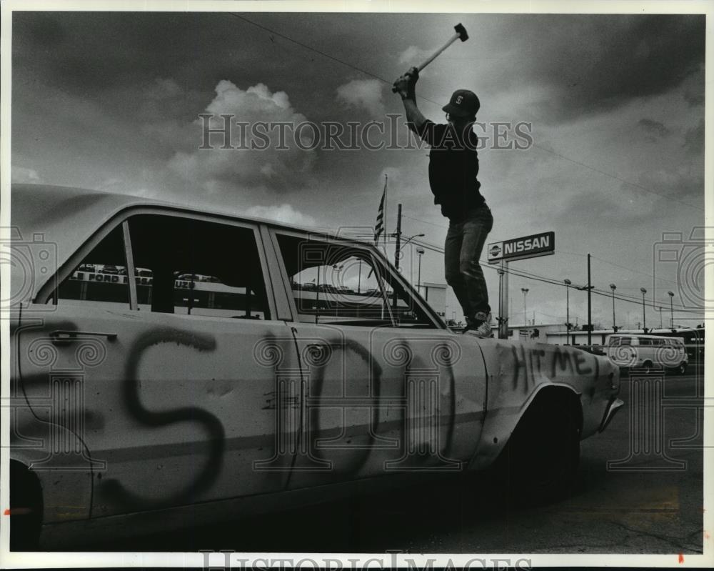 1991 Press Photo Chris Fisher during a Car Smashing Fund Raising - spa39924 - Historic Images