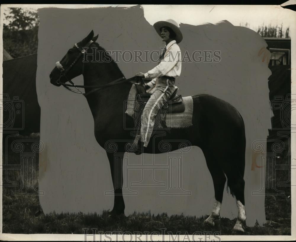 1941 Press Photo A woman sitting on her horse at an encampment - neo00688 - Historic Images