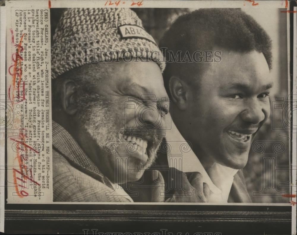 1973 Press Photo George Foreman with his Adviser Archie Moore - nef59741 - Historic Images