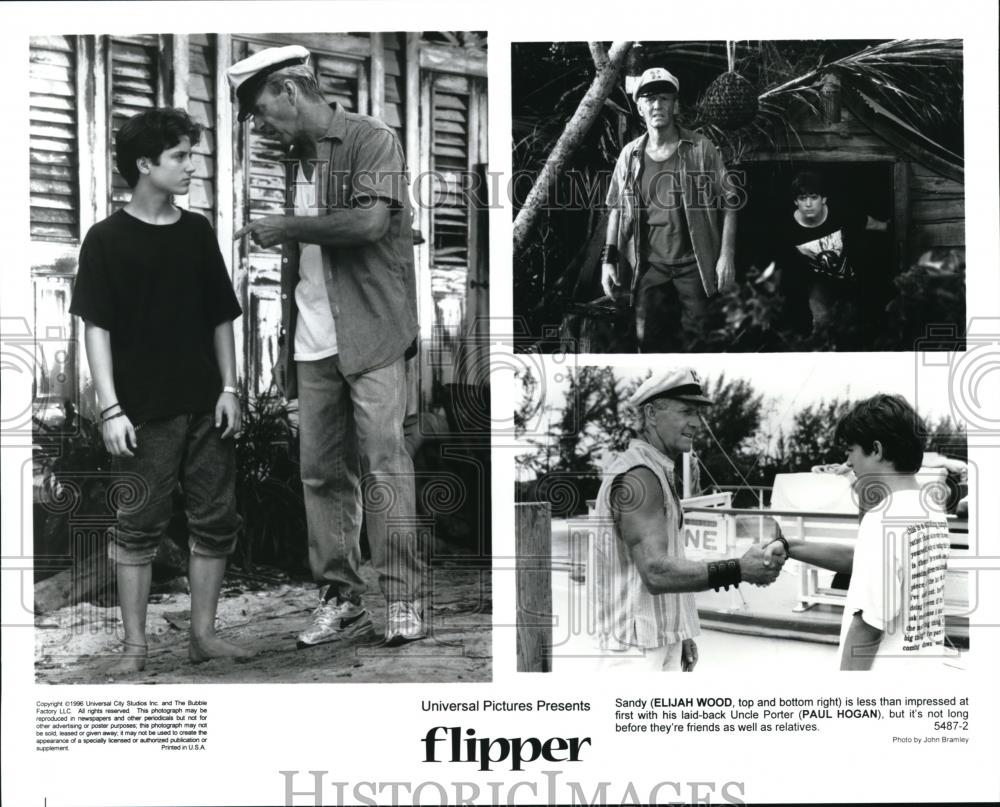 1996 Press Photo Ellijah Wood and Paul Hogan in Flipper - cvp41847 - Historic Images