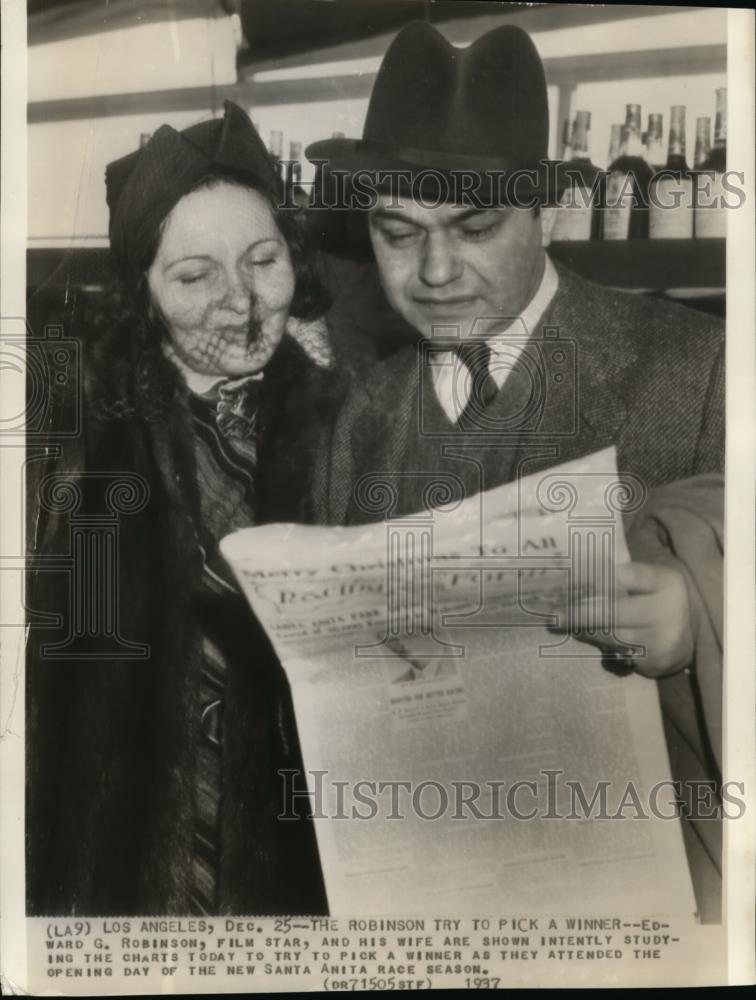 1937 Wire Photo Edward G. Robinson, film star, and his wife studying the charts - Historic Images